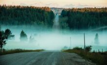 photo of concrete road towards mountain